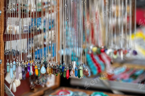 Preview: Colorful Handmade Jewelry Displayed at Artisan Market Stall During Sunny Afternoon
