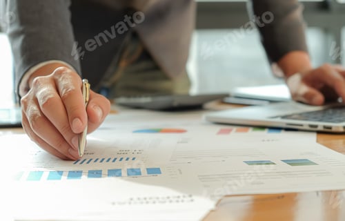 Preview: Businessmen use pen, laptop and mobile phone are planning a marketing plan to improve work quality.