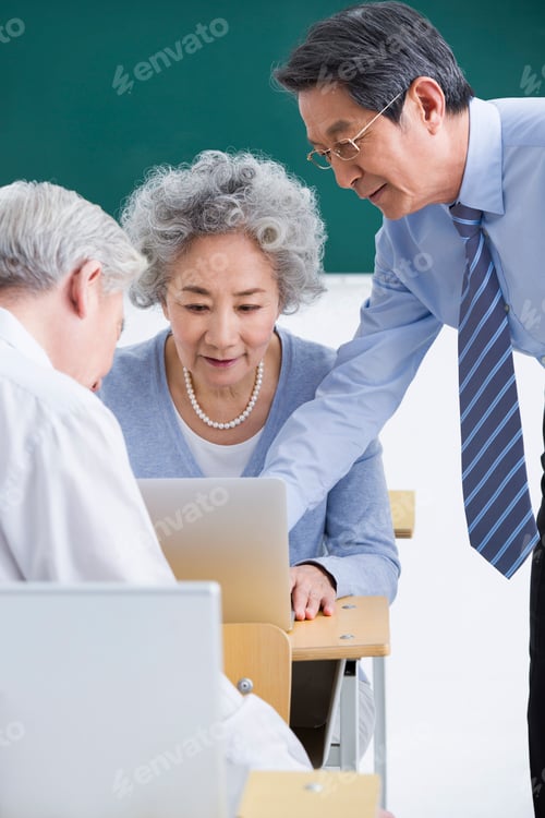 Preview: Senior adults having computer class at school