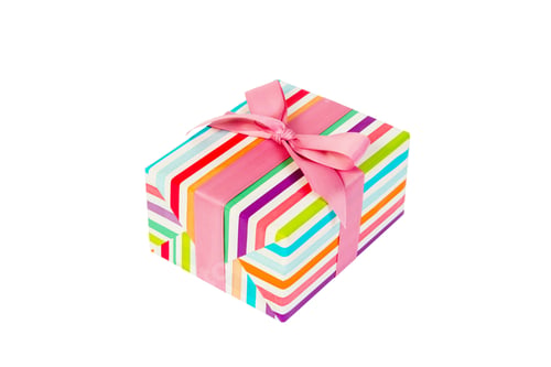 Preview: Christmas or other holiday handmade present in colored paper with pink ribbon