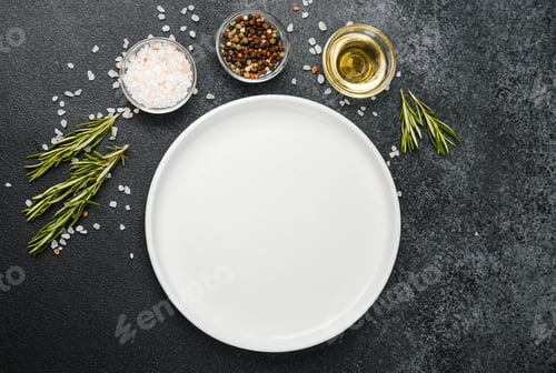 Preview: Empty white plate with herbs and spices on black stone background