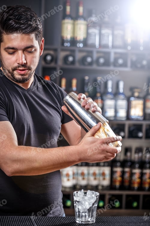 Preview: Barman is shaking alcohol cocktail