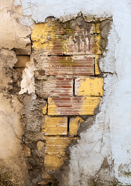 Preview: Architectural background from an old wall with yellow stone bricks in a stack