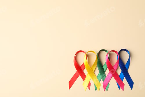 Preview: Flat lay composition with awareness ribbons on color background, space for text.