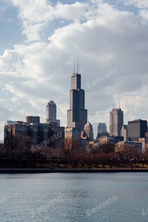 Preview: Stunning view of a large city skyline situated above a tranquil Lake Michigan at daytime, Chicago