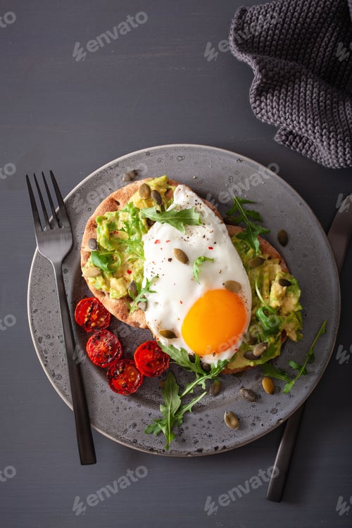 Preview: breakfast avocado sandwich with fried egg and tomato