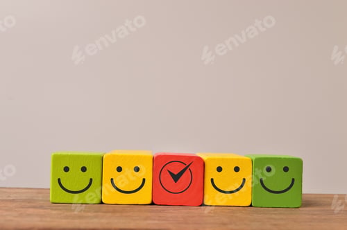 Preview: Colorful wooden blocks with emotion face. Customer evaluation and satisfaction concept.