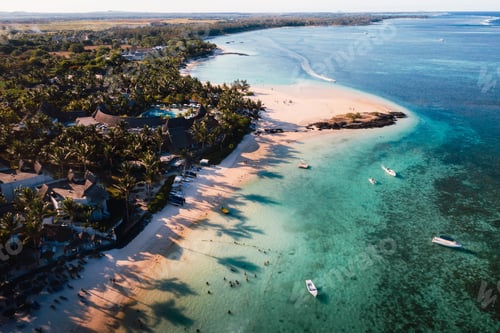 Preview: Aerial picture of the east coast of Mauritius Island. Flying above the turquoise lagoon of Mauritius