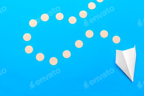 Preview: Flat lay of white paper plane and blank paper on pastel blue color background