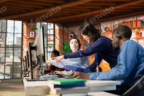 Preview: Call center manager evaluating multiethnic team performance