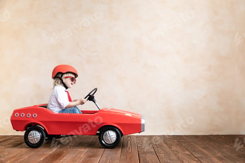 Preview: Funny kid driving toy car at home