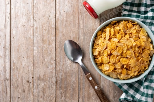 Preview: Corn flakes in a blue bowl and milk bottle