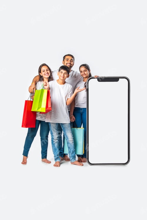 Preview: asian Indian family promoting sale offer standing with big tall smartphone cutout