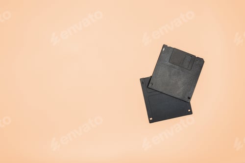 Preview: Old floppy disks on a plain background showing vintage technology from the past