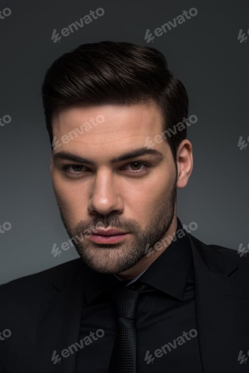 Preview: Headshot of stylish man in suit isolated on grey
