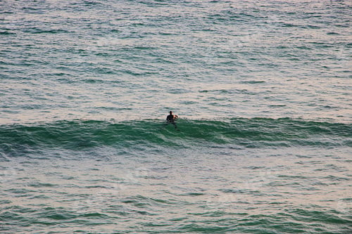 Preview: Man swimming in the sea during daytime