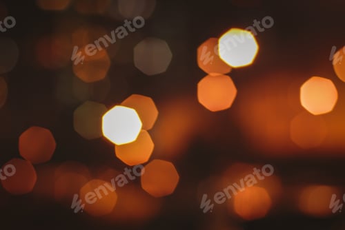 Preview: Blurry street lights at night, abstract background of bokeh warm light
