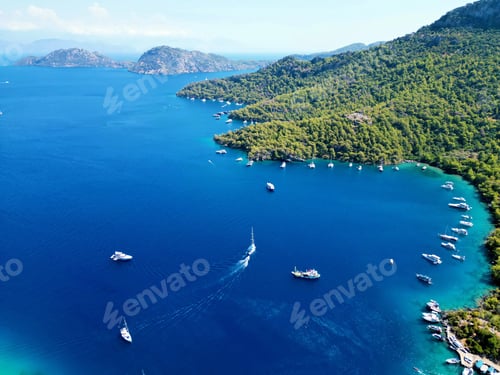 Preview: Aerial of sea cliffs and boats sailing along the coast