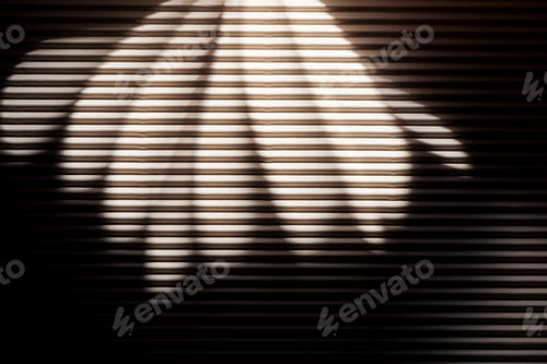 Preview: White rays on black textured surface in darkness