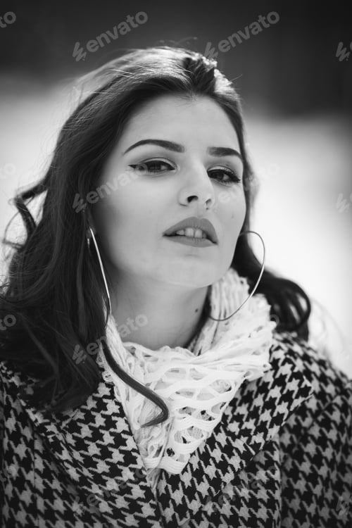 Preview: Grayscale portrait of a young Caucasian female wearing a coat and a scarf