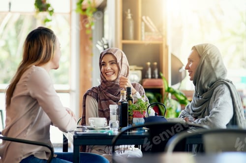 Preview: Shot of a group of women chatting over coffee in a cafe