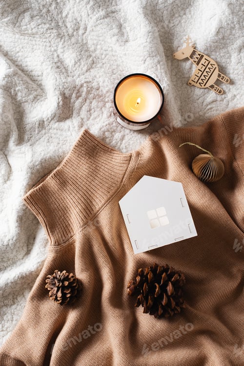 Preview: Cozy warm beige sweater and wooden house flat lay
