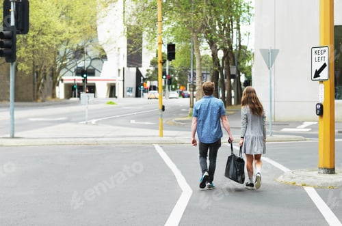 Preview: Young couple carrying bag together on street, Melbourne, Victoria, Australia