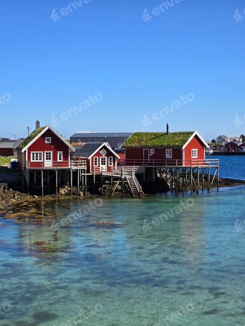 Preview: Charming Red Cabins On Stilts Over Crystal Clear Waters In Norway, Lofoten Norway