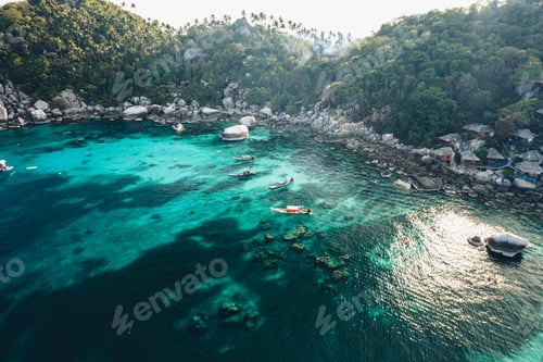 Preview: Island and boat in clear sea at Koh Tao