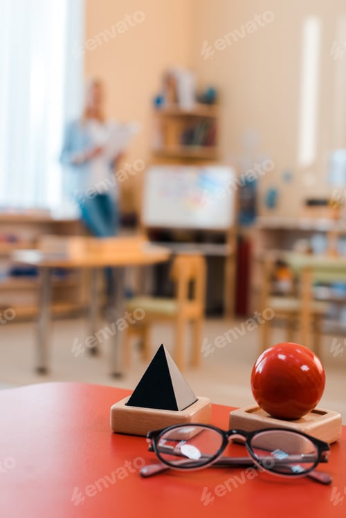 Preview: Classroom Objects on a Desk with Teacher