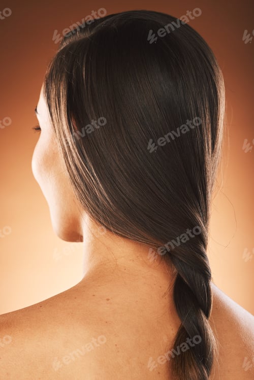 Preview: Back, hair care and woman with natural beauty, cosmetics or hairstyle against brown studio backgrou