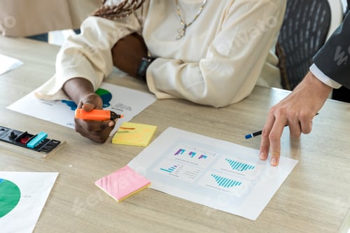 Preview: Diverse colleagues gather in brainstorm discuss statistics together.