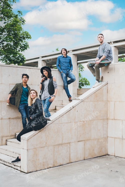 Preview: Group of young multiethnic friends posing outdoor