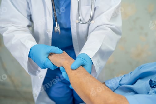 Preview: Doctor Comforts Senior Patient by Holding Hand
