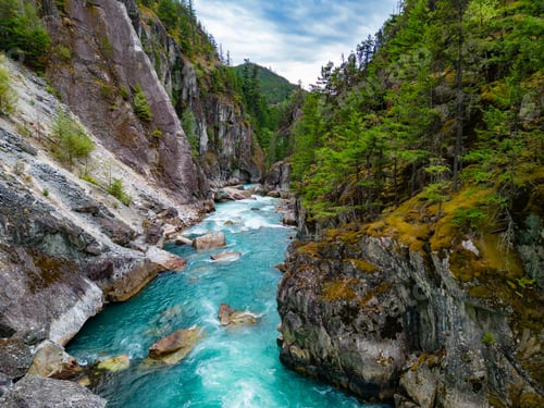 Preview: River in a Rocky Mountain Canyon. British Columbia, Canada. Aerial Nature Background
