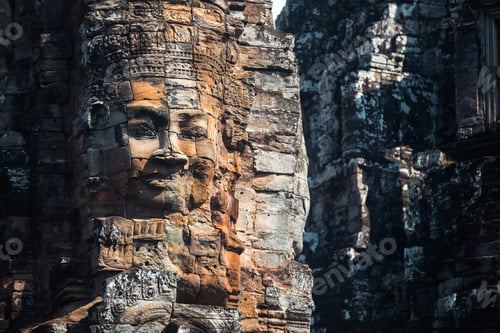 Preview: Serene and smiling stone face on Bayon temple