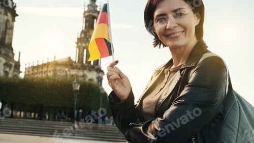 Preview: Young Woman Smiles With German Flag In Hand