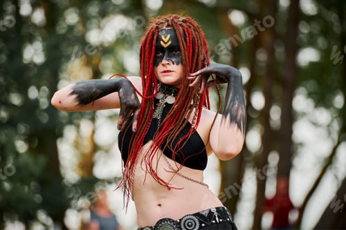 Preview: Mythological dancing girl faun on green lawn in public park outdoor art dancing event