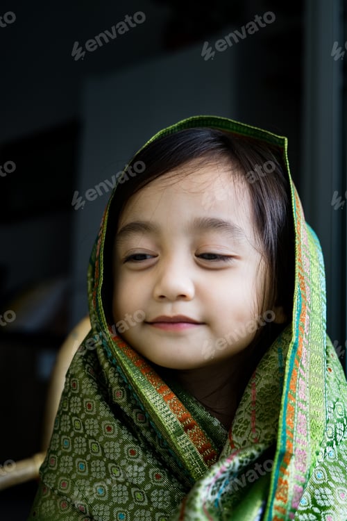 Preview: Portrait little asian girl wearing traditional Malaysia, Thailand, Indonesian Songket, shawl.