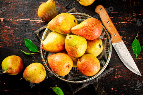 Preview: Ripe pears in a colander.
