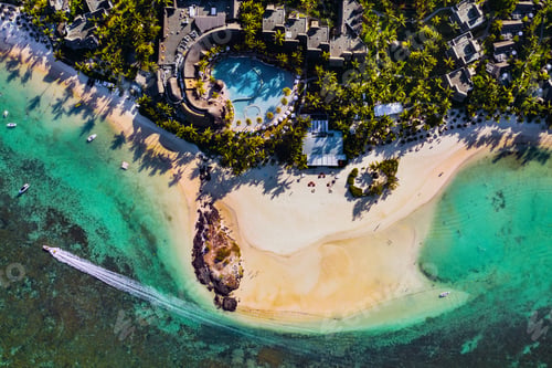 Preview: Aerial picture of the east coast of Mauritius Island. Flying above the turquoise lagoon of Mauritius