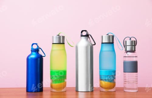Preview: Different water bottles for sports on color background