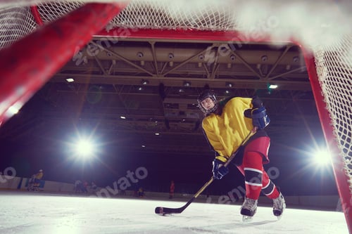 Preview: teen ice hockey player in action
