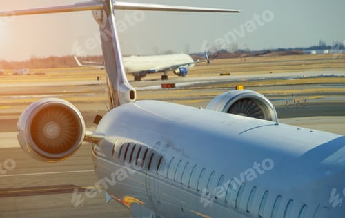 Preview: Jet engine against a middle size plane at the airport on loading aircraft at the International