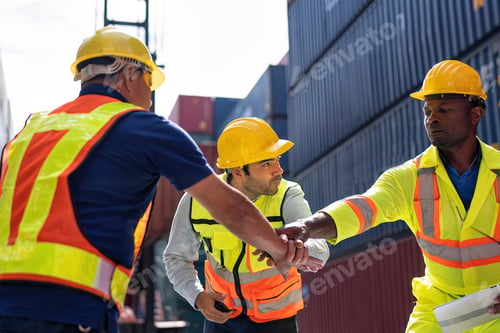 Preview: 3 engineer working in container storage yard hand gathering boosting morales prepare to delivery