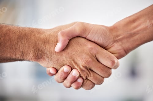 Preview: Closeup of two businessmen shaking hands in the office. Unknown mixed race professionals and collea