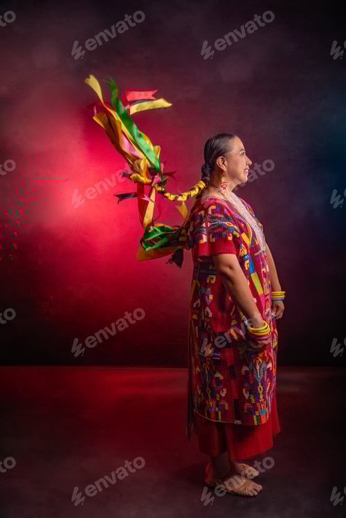 Preview: A woman wearing a red dress with a long piece of ribbon tied to her back