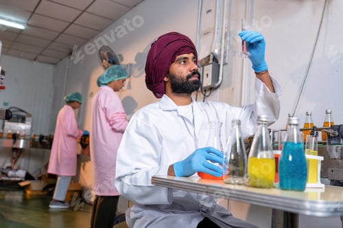 Preview: Beverage laboratory room worker in drink factory take product sample to tube and quality assurance