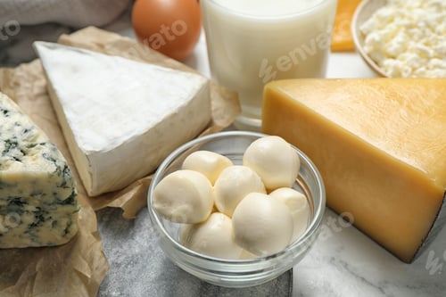 Preview: Different delicious dairy products on table, closeup