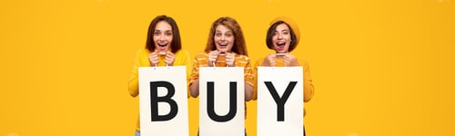 Preview: Happy women with shopping bags saying Buy